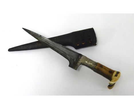 An antique Islamic knife, with pierced and decorated leather scabbard, length 30cm.