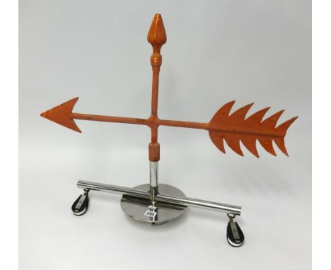 A weather vane from Royal Western Yacht Club, with chrome base, height 60cm.