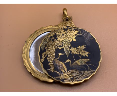A Vintage Japanese Shakudo Damascene locket and compact mirror. (A)