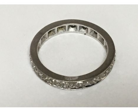 An 18carat white gold platinum ring set with a row of small diamonds ring size K weight 3g