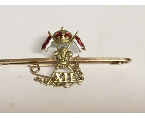 A 15 ct gold and enamel brooch 3.8 grams.