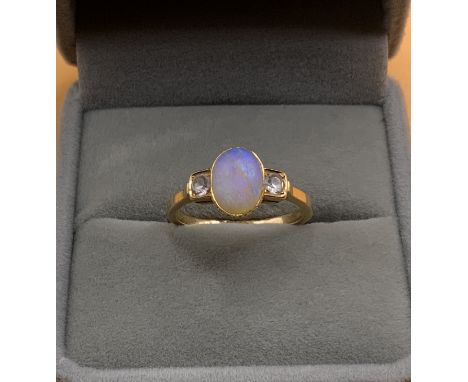 A 1930s 18ct gold opal and diamond set ring. Size O. (A)