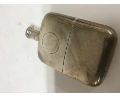 A Victorian silver hip flask with detachable parcel gilt base London hallm arks screw cap weight 186g 13cm x 8cm