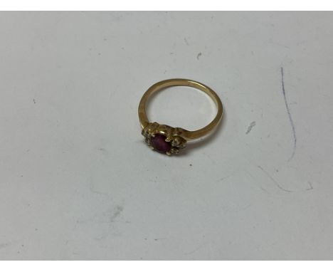 A 14ct gold ruby and diamond set ring. Approx 2.79 grams, ring size Q.