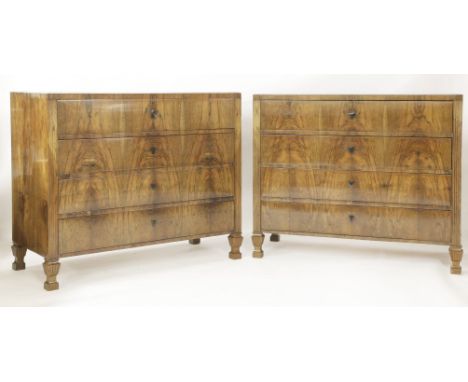 A matched pair of Biedermeier walnut four-drawer commodes,c.1830, each with a bevelled caddy top over drawers with ebony shie