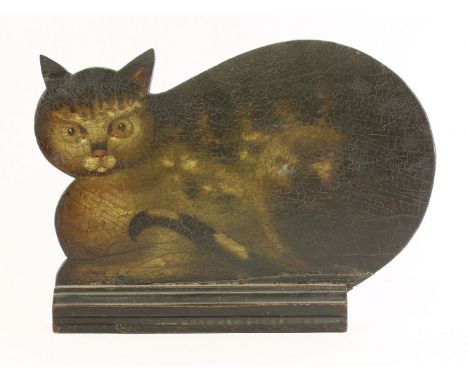 An unusual cat mantelpiece dummy board,early 19th century, in the form of a crouching tabby mounted in a moulded wooden base,