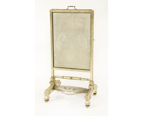 Royal interest: a late Georgian giltwood cheval fire screen,with a rise and fall damask-covered panel and a hinged shelf, bea