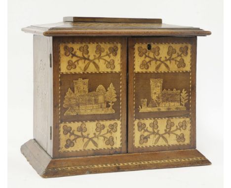 A Killarney table cabinet,mid 19th century, with inlaid decoration, the top with Glena Cottage, the front with Muckrose Abbey