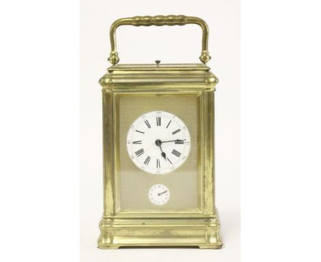 A French brass carriage clock,second half of the 19th century, with repeating mechanism and alarm dial, striking the quarters