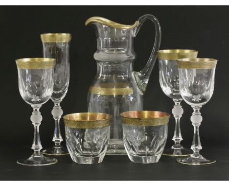 A suite of cut and faceted Glassware,with gilt rims, engraved with scrolling floral design, to include:ten red wine glasses, 