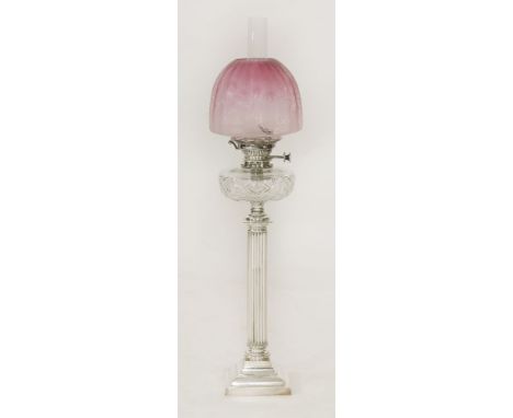 An Edwardian silver-plated oil lamp,with an etched cranberry shade, Hinks No. 2 lever, cut glass reservoir and reeded column 