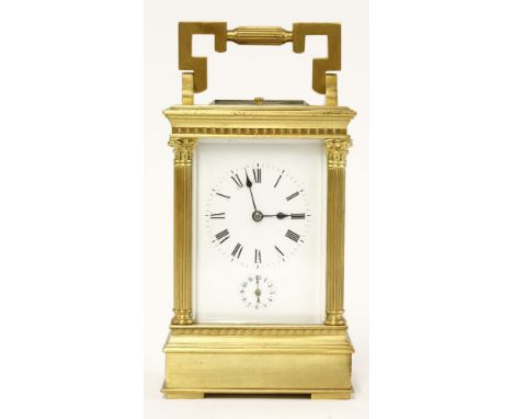 A French brass carriage clock,with four three-quarter Corinthian columns, platform escapement, striking the half hours on a g