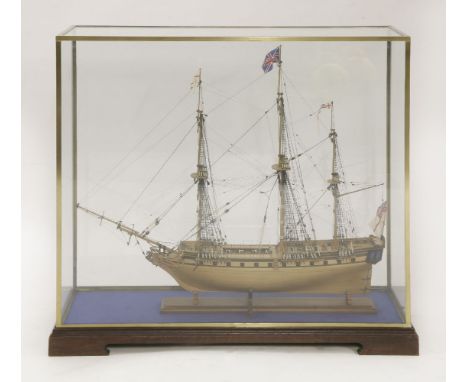 A scale model of HMS Unicorn,with three masts, in a glass case, ship 75cm highcabinet 86cm wide36cm deep90cm high