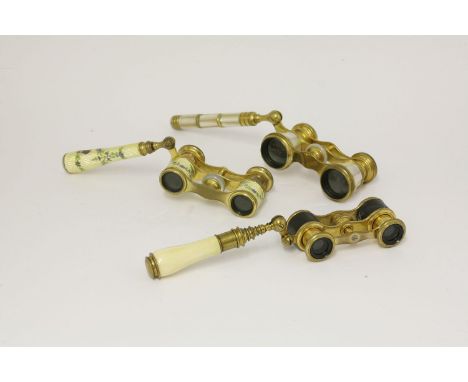 Three pairs of opera glasses,Iris of Paris, mother-of-pearl and gilt metal,Mappin & Webb, Paris engine turned and enamel,Flam