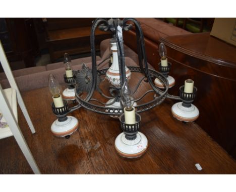 A vintage metal and ceramic ceiling light fitting