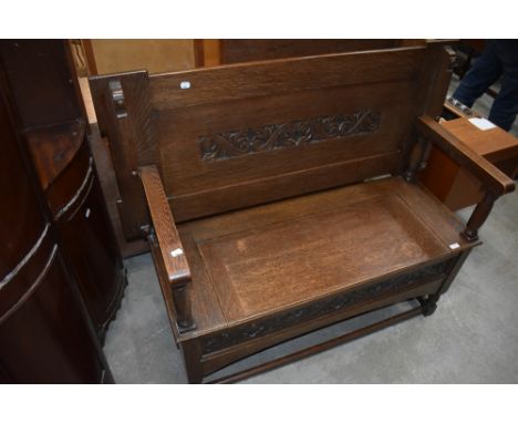 A traditional oak monks bench