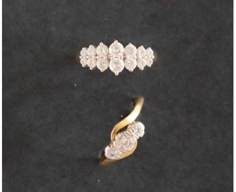 A three stone diamond ring set with round old cut diamonds to a white metal setting and 18ct gold shank, size R, approximatel