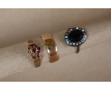 A 9ct gold wedding band, size R, approximately 2.5 grams together with two other 9ct gold rings, approximately 5 grams
