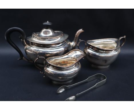 A George V silver three piece tea set of oval form, Sheffield, 1923, Martin Hall & Co Ltd, approximately 1020 grams and a pai