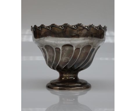 An Edward VII silver pedestal rose bowl, with a wheathusk scrolling border, and twisted tapering bowl on a spreading foot, Bi