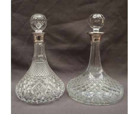 An Elizabeth II silver topped and cut glass ships decanter, Birmingham, 1996, together with another silver topped and crystal