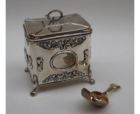 An Edward VII silver tea caddy of rectangular form, Chester, 1905, together with a George III silver caddy spoon, Birmingham,