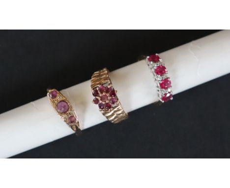 A 9ct gold ruby set cluster ring, set with nine round faceted rubies to a 9ct yellow gold setting and shank, size P, together