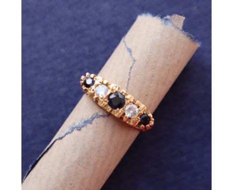 An 18ct gold sapphire and diamond dress ring, set with three round faceted sapphires and two round old cut diamonds, size R, 