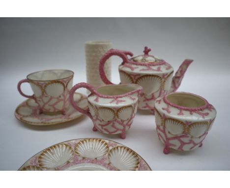 A Victorian Belleek shell and coral bachelor part tea set comprising a tea pot, cream jug, sugar basin, tea cup and 2 saucers