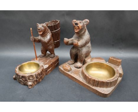 A Black Forest carved bear cigarette holder, brass ashtray and matchbox holder, 18cm wide together with another Black Forest 