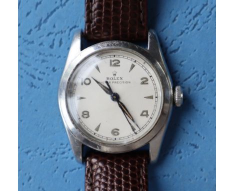 A stainless steel Rolex Oyster precision wristwatch, the silvered dial with Arabic numerals and pointed arrow markers, 30mm d