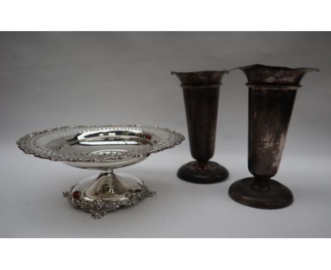 A Blair & Crawford sterling silver pedestal dish with a pierced scrolling edge and shaped foot, together with a pair of silve