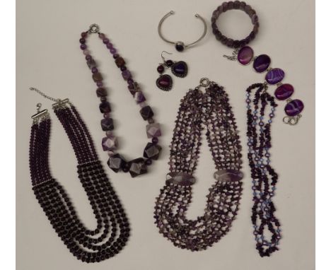 Amethyst set necklaces together with amethyst coloured bracelets etc 