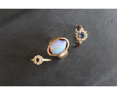 A 9ct gold opal set ring, size R together with a 9ct gold sapphire and diamond cluster ring, size Q 1/2, approximately 10.5 g