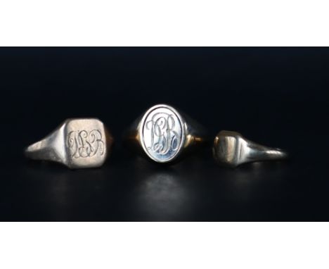 A 9ct gold Masonic ring with revolving panel, size V 1/2 together with two 9ct gold signet rings, sizes R 1/2 and L 1/2, appr