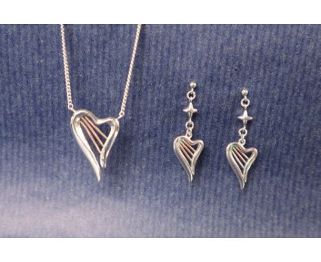 A Clogau silver and gold detailed "Heartstrings" harp shaped pendant on a chain, together with a matching pair of earrings, a