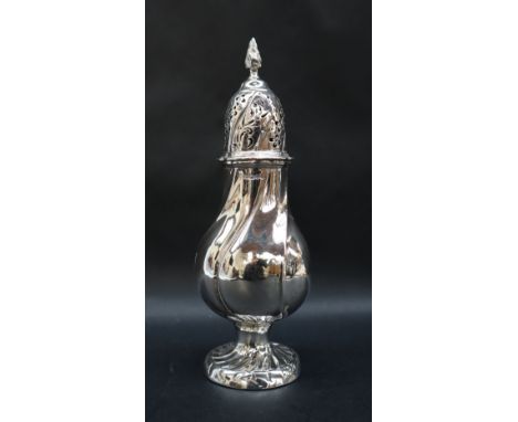 A Victorian silver sugar caster with a flaming finial and twisted domed pierced top and baluster body on a spreading foot, Sh
