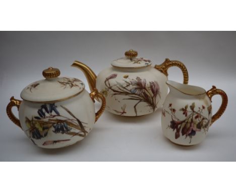 A Worcester three piece teaset, transfer and infil decorated with flowers and leaves to an ivory ground with ribbed gilt hand