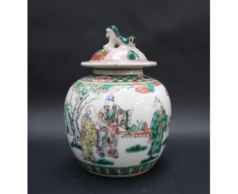 A Chinese Famille Verte porcelain vase and cover, the domed cover with a dog of foo finial, the bulbous body decorated with d