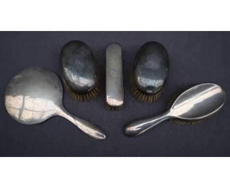 A pair of George V silver brushes, Sheffield, 1910, Walker and Hall together with two other silver backed brushes and a silve