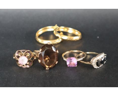 A 9ct yellow gold amethyst set dress ring together with two other 9ct gold rings another ring and silver gilt earrings