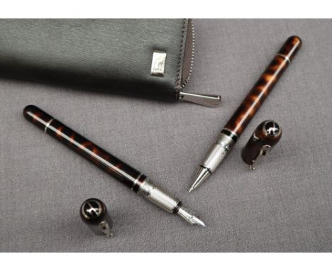 A pair of Dunhill sidecars pens, including a fountain pen with 18ct white gold nib and a matching rollerball in tortoiseshell