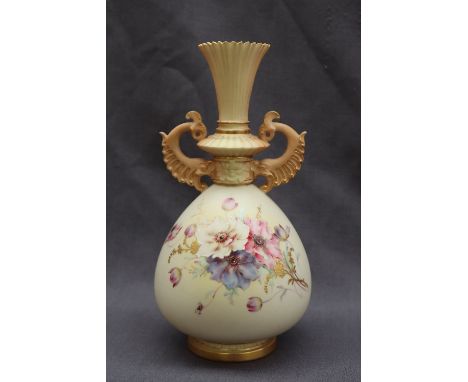 A Royal Worcester porcelain twin handled vase with a flared neck and scrolling handles, the tapering body decorated with flow