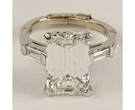 GIA Certified 6.85 Cart Emerald Cut Diamond and Platinum Ring. Diamond K color, VVS2 clarity. Very good condition. Ring size 