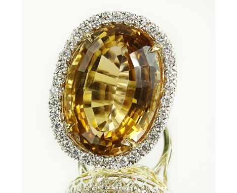 Lady's Gem Quality Approx. 29.86 Carat Oval Cut Citrine, .95 Carat Round Cut Diamond and 18 Karat Gold Ring. Citrine measures
