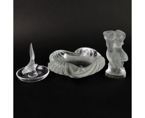 Lot of Three (3) Lalique Crystal Items. This lot includes an ashtray or nut bowl 6-1/2" Dia; Woman and Faun Figurine 5-1/2"; 