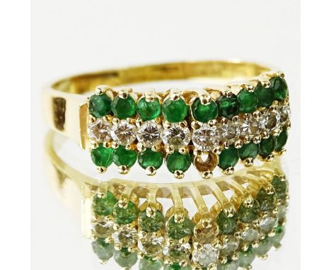 Lady's Emerald, Diamond and 14 Karat Yellow Gold Ring. Emeralds with vivid saturation of color. Signed 14K. Very good conditi