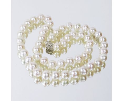 Lady's Single Strand 8.5mm White Pearl Necklace with 14 Karat White Gold Clasp. Clasp Signed. Pearls with good color and lust