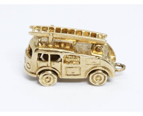 A hallmarked 9ct gold charm modelled as a fire engine, length 21mm, weight 4.5g.  