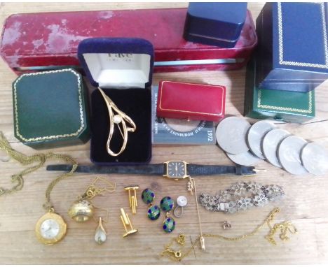 A box of assorted costume jewellery including a pair of hallmarked silver gilt and enamel cufflinks, two vintage pendant watc